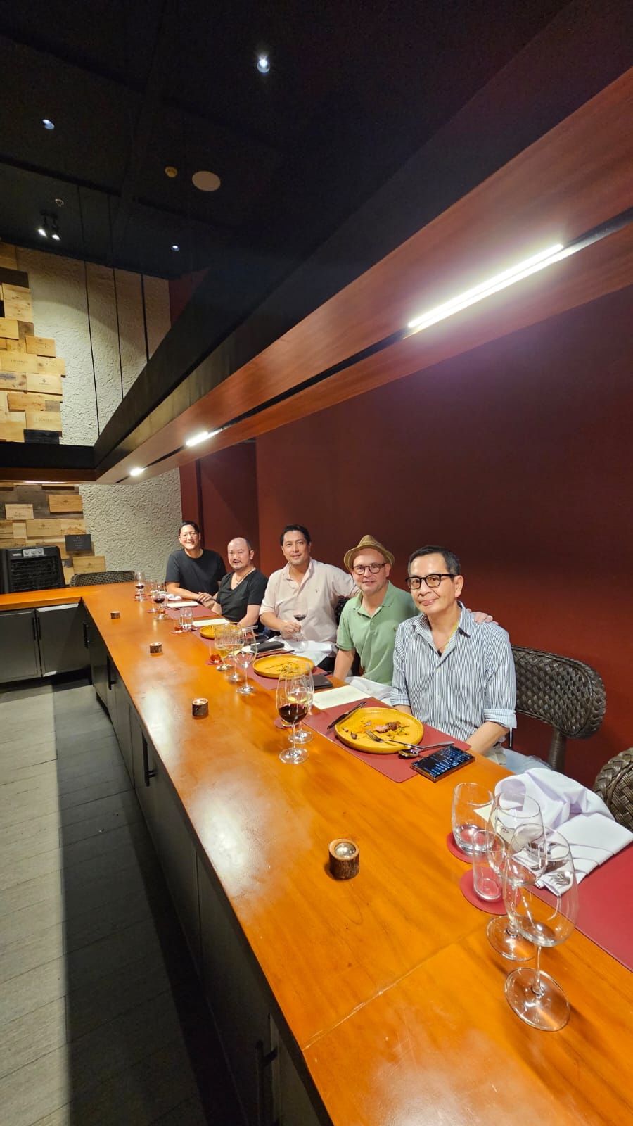 Goxo intimate 12-seat counter dining experience in Salcedo Village with warm wood accents and elegant plating